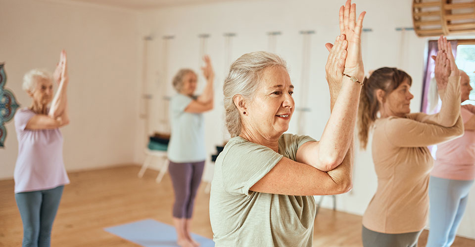 Women exercising, hands in the air