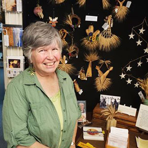 Picture of woman in front of museum artifacts