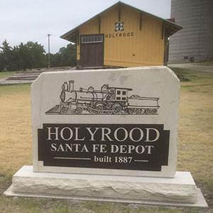 Stone sign of the Santa Fe Train Depot in front of the renovated building