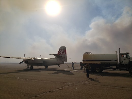 Tanker and airplane at scene of wildfire