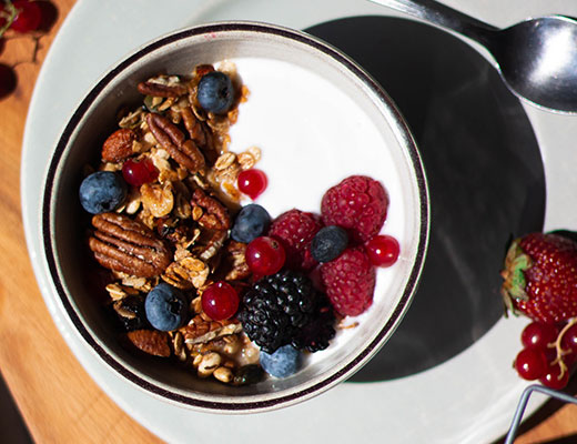 Fruits and nuts inside a white bowl