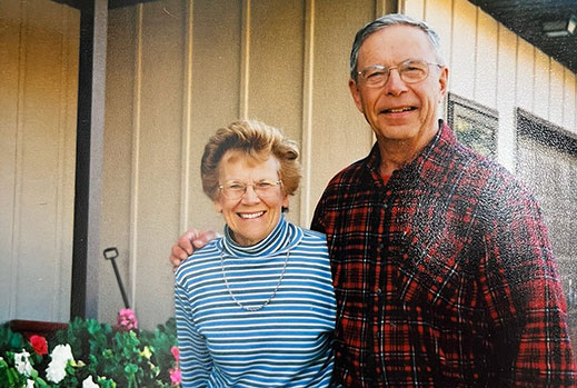 Eula Mae and Don Goodfellow, standing in front of their home